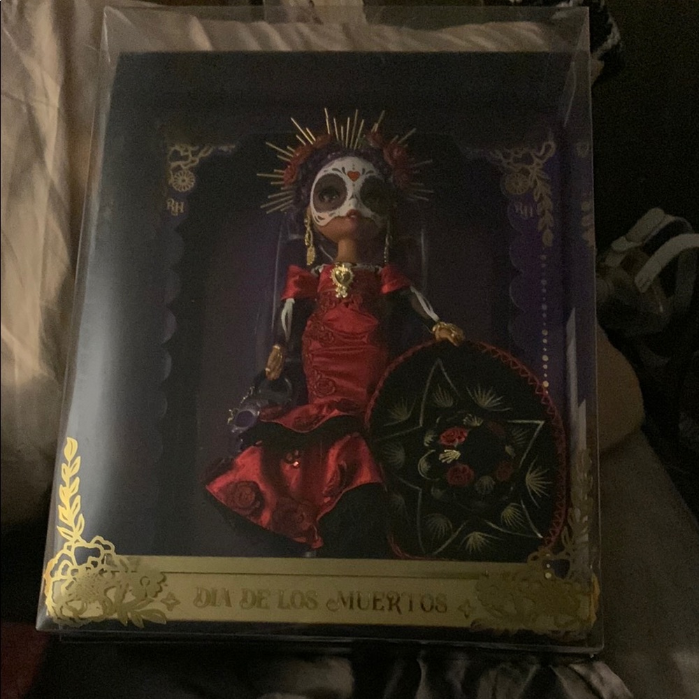 Red and Black Collectible Doll with Accessories